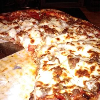 Dan's Pizza - Ultimeat! 10 meats, their homemade sauce, double cheese. A whole lot of amazing. - Pizza Near Me - Webster, Texas