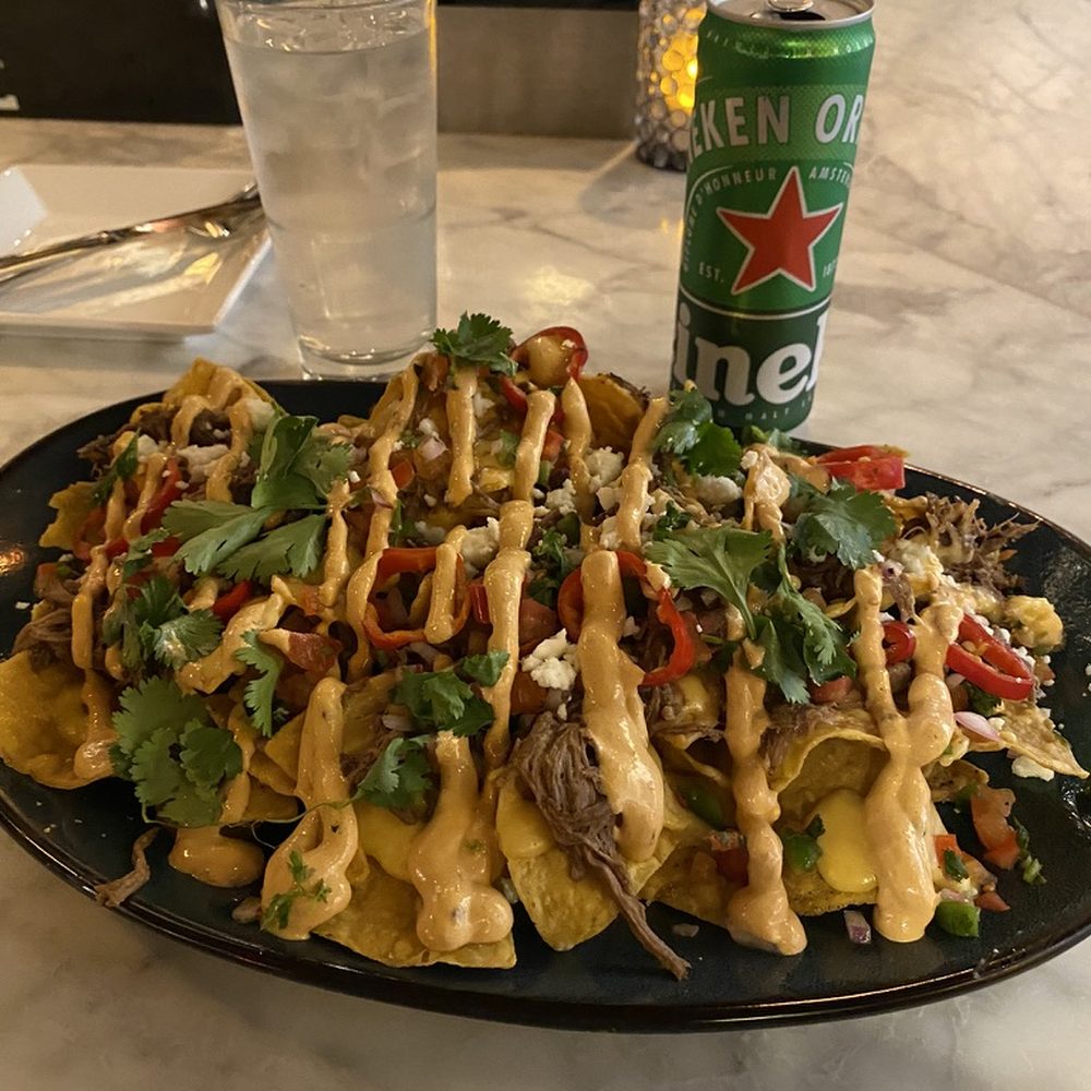 SPIN Seattle - Nachos; Short Rib, Jack, Cheddar, Pickled Fresno, Pico De Gallo, Chipotle Crema - American Near Me - Seattle, Washington SPIN Seattle - Nachos; Short Rib, Jack, Cheddar, Pickled Fresno, Pico De Gallo, Chipotle Crema - American Near Me - Seattle, Washington