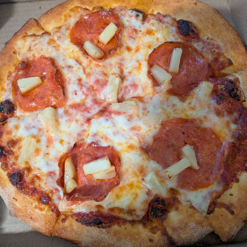 Worst pizza I've got from this place. Hardly any toppings ($2 each!) misshapen, sliced terribly Worst pizza I've got from this place. Hardly any toppings ($2 each!) misshapen, sliced terribly