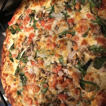 Papa Murphy's - a pizza on a stove top - Pizza Near Me - Arlington, Texas Papa Murphy's - a pizza on a stove top - Pizza Near Me - Arlington, Texas