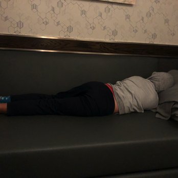 Minute Suites - Little man enjoying the bed with provided pillows/blankets. - Hotels Near Me - Charlotte, North Carolina Minute Suites - Little man enjoying the bed with provided pillows/blankets. - Hotels Near Me - Charlotte, North Carolina