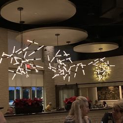 Aldo's Ristorante Italiano - From bar seating, looking over the main dining area.  Stylized lighting fixtures...