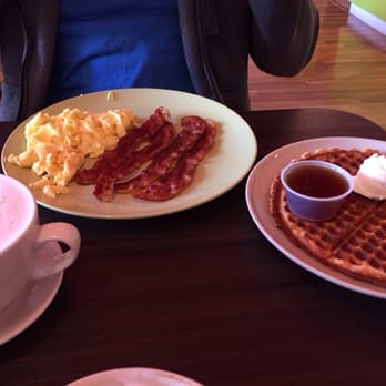 Simple scrambled eggs, bacon and a waffle.