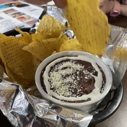 Las Hamacas - Complimentary chips with refried beans, cheese, and sour cream.