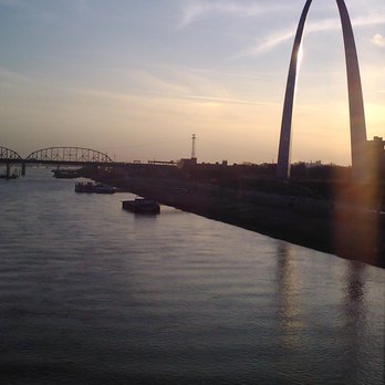 MetroLink - Crossing the mighty Mississippi River on a Metrolink train and seeing the Gateway Arch in the early evening. - Public Transportation Near Me - Saint Louis, Missouri MetroLink - Crossing the mighty Mississippi River on a Metrolink train and seeing the Gateway Arch in the early evening. - Public Transportation Near Me - Saint Louis, Missouri