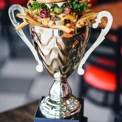 Taystee's Burgers - Burger and Fries in an awarded cup to Taystee's Burgers - Home of the Best Burgers in Town