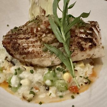 Red Ash - SAUTEED NORTH PACIFIC HALIBUT* sweet corn risotto / fava beans / calabrian chile / chervil - Italian Near Me - Austin, Texas
