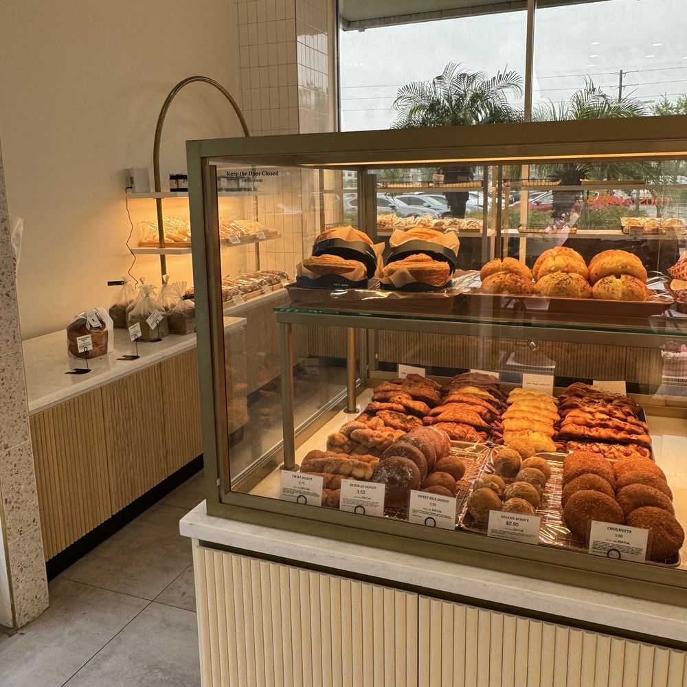 Tous Les Jours - A small portion of the fresh pastry display...so many choices... - Coffee & Tea Near Me - Wesley Chapel, Florida Tous Les Jours - A small portion of the fresh pastry display...so many choices... - Coffee & Tea Near Me - Wesley Chapel, Florida
