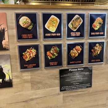 Thai Eats - A menu board at Thai Eats in Oak Lawn, IL, shows images and names of Thai dishes including fried rice, stir-fry, and curry. - Noodles Near Me - Oak Lawn, Illinois