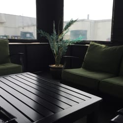 Emerson's Cigars - Cozy outdoor smoke lounge.