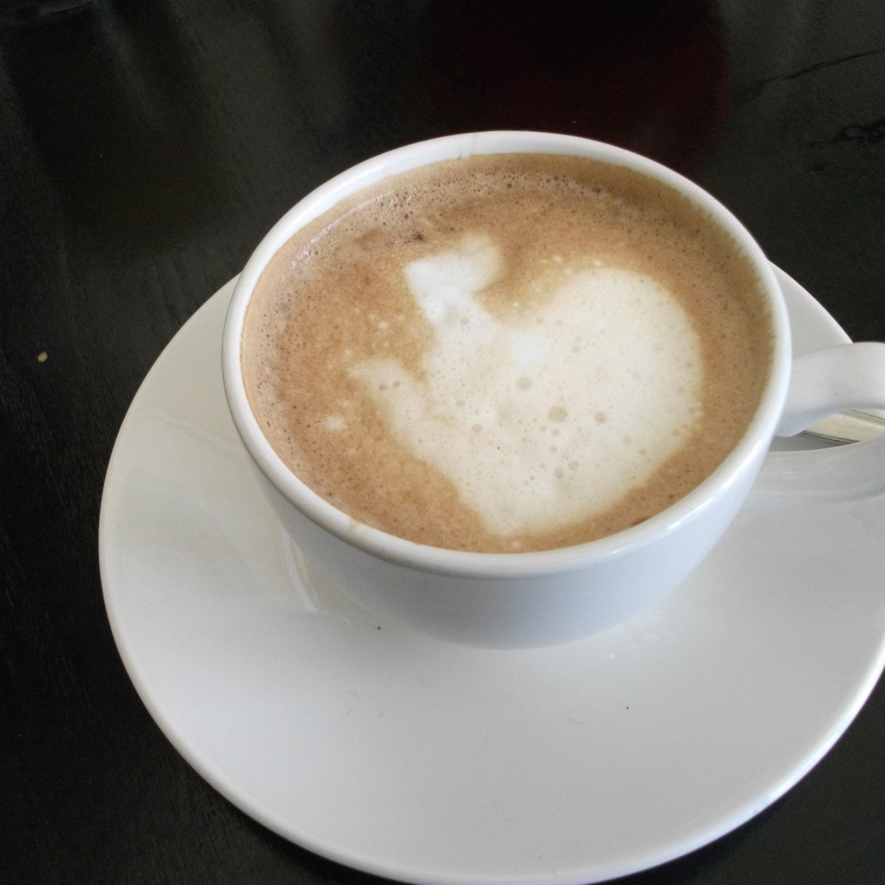 the way to start off a day - a white coffee the way to start off a day - a white coffee