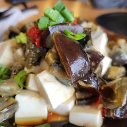 Delicious century egg with silken tofu in soy vinaigrette