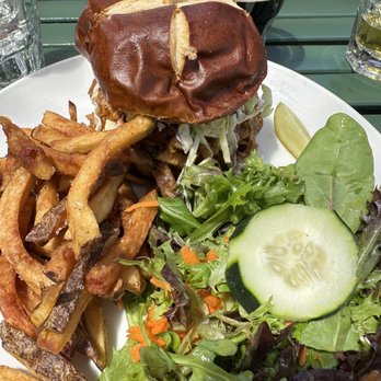 Railroad Station Bar and Grill - Pulled Pork Sandwich on Pretzel Bun, fries and salad - New American Near Me - Cloverdale, California Railroad Station Bar and Grill - Pulled Pork Sandwich on Pretzel Bun, fries and salad - New American Near Me - Cloverdale, California