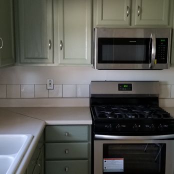 Protective Advanced Coatings - After, with new appliances, beautiful new painted cabinets and new cabinet hardware - Painters Near Me - Oxnard, California