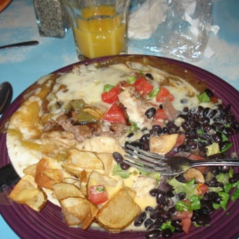 The Range Café - 8 oz. grilled burger, open-faced on a flour tortilla, smothered with green chile, cheese, grilled onions and potatoe weedges - Mexican Near Me - Bernalillo, New Mexico