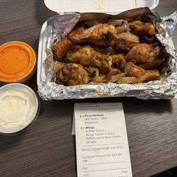 Urban CoalHouse Pizza + Bar - Look closely at the receipt "toss in extra sauce" but dry wings no sauce came