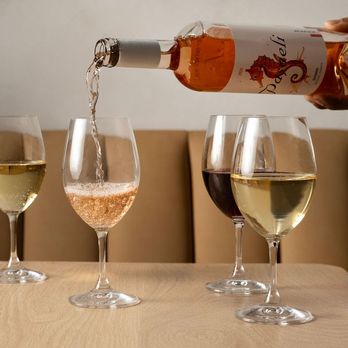 The Noble - three glasses of wine being poured - Mediterranean Near Me - Brooklyn, New York The Noble - three glasses of wine being poured - Mediterranean Near Me - Brooklyn, New York