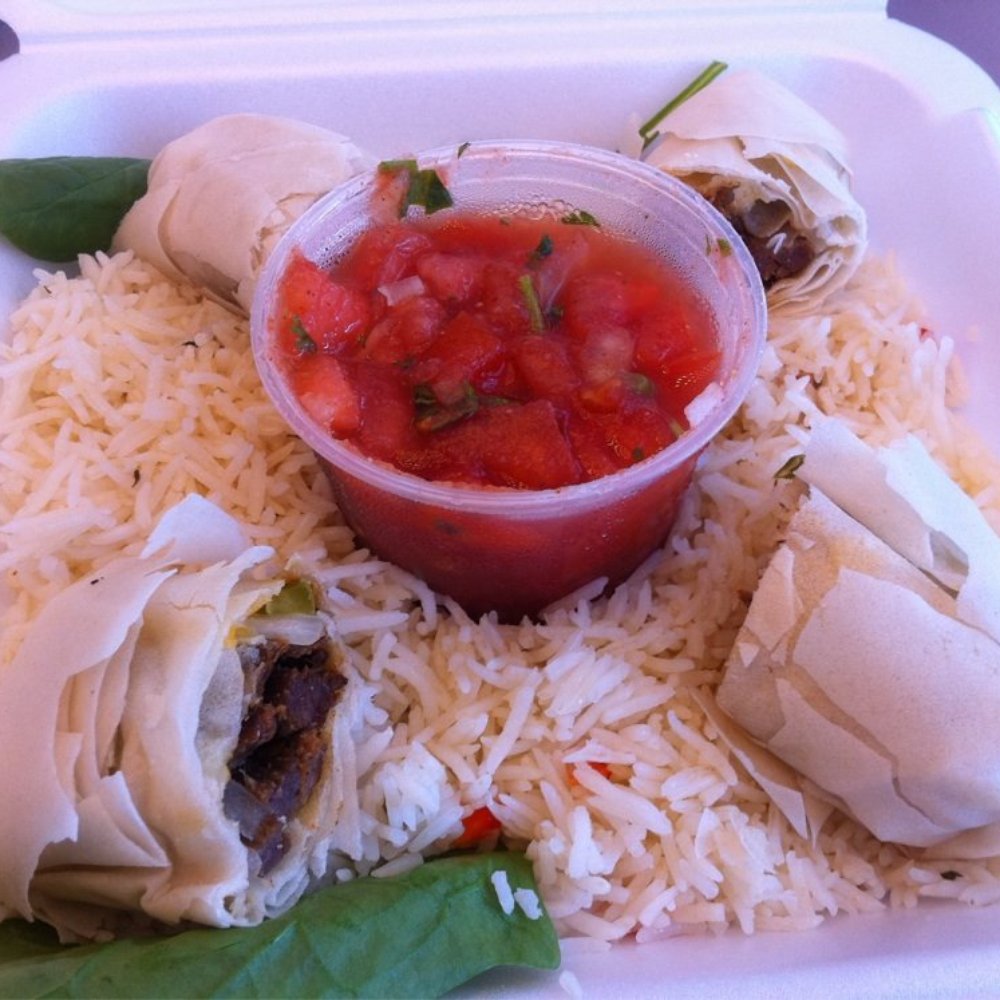 Doug the Food Dude - Steak fajita egg rolls on rice with spinach leaves - Seafood Near Me Doug the Food Dude - Steak fajita egg rolls on rice with spinach leaves - Seafood Near Me