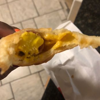 Shipley Do-Nuts - a person holding a hot dog - Donuts Near Me - Killeen, Texas