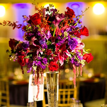 An Added Touch Flowers - Tall centerpiece - Floral Designers Near Me