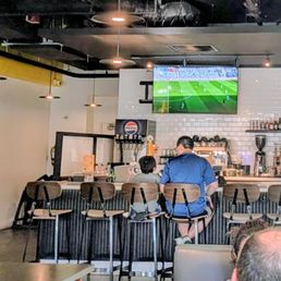 Bar seating and TV. Bar seating and TV.