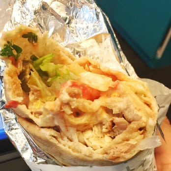 Pita Lite - a hand holding a burrito - Mediterranean Near Me - Mississauga, Ontario Pita Lite - a hand holding a burrito - Mediterranean Near Me - Mississauga, Ontario