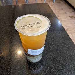 Passion fruit Green Tea with boba and lychee jelly