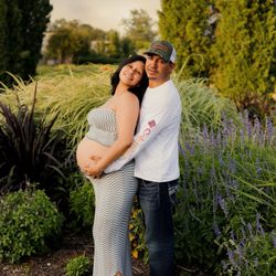 Peek At Baby - Mother and father with baby bump