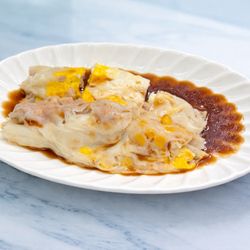 Rice noodle roll with corn, pork, and egg.