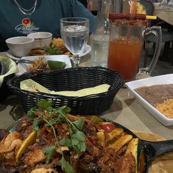 Safari Club - Fajitas mixtas (beef, chicken, shrimp) came w/ side of beans and rice and tortilla (choice of corn or flour) - Seafood Near Me - Dinuba, California Safari Club - Fajitas mixtas (beef, chicken, shrimp) came w/ side of beans and rice and tortilla (choice of corn or flour) - Seafood Near Me - Dinuba, California