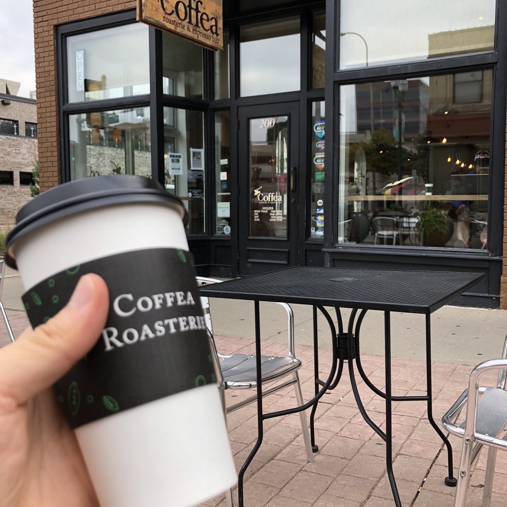 Coffea - a person holding a cup of coffee - Coffee & Tea Near Me - Sioux Falls, South Dakota