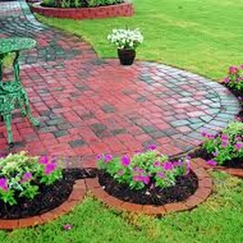Pro Lawn Cut - a brick patio surrounded by flowers - Landscaping Near Me - Austin, Texas Pro Lawn Cut - a brick patio surrounded by flowers - Landscaping Near Me - Austin, Texas