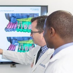 UCSF Oral and Maxillofacial Surgery - Dr. Bast and Dr. Odera evaluating a patient for surgery