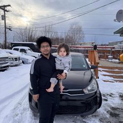 Patriot Auto Brokers - A picture of me and my son with my new car.