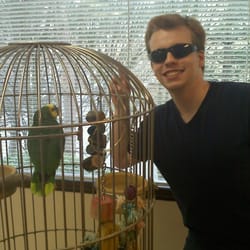 David Weed J, DDS - My brother just got his braces off and decided to pose with Dr. Weed's parrot.