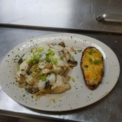 Northern Trax Bar and Grille - Smothered chicken with twice baked potato