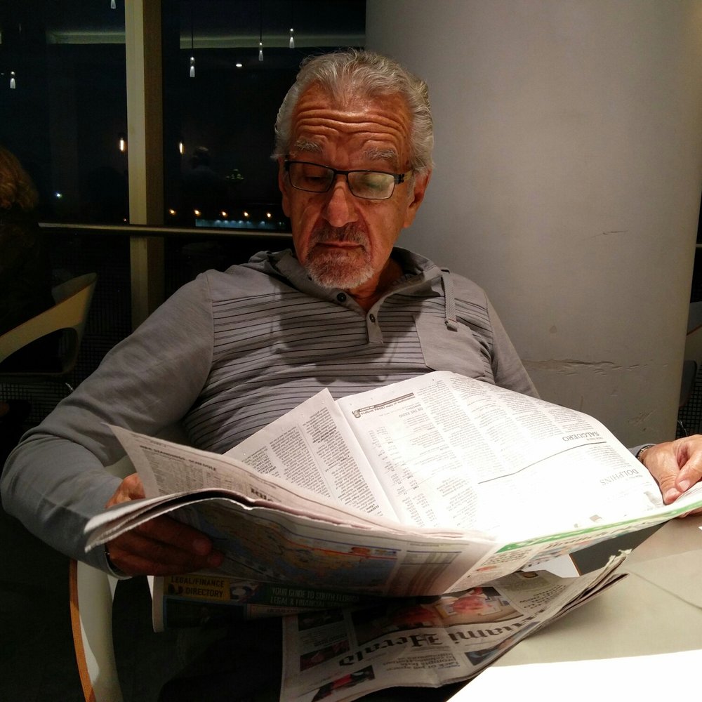 The Centurion Lounge - Hernando reading the newspaper. - Airport Lounges Near Me - Miami, Florida