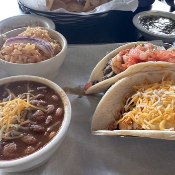 JoVi's Tacos - Cantina beans, Spanish rice, buffalo chicken taco and surf n turf taco (best) Chips n salsa in the background - Mexican Near Me - Baton Rouge, Louisiana JoVi's Tacos - Cantina beans, Spanish rice, buffalo chicken taco and surf n turf taco (best) Chips n salsa in the background - Mexican Near Me - Baton Rouge, Louisiana