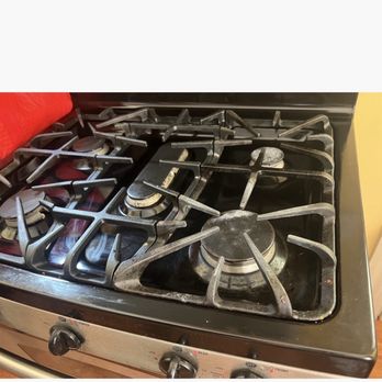 Kk Deep & Standard Cleaning - Food debris still attached to the stove cover after "cleaning" - Home Cleaning Near Me