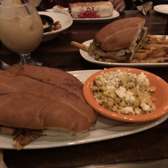 Session Taco - Delmar Loop - Chicken torta with a side of corn off cob and my drink-Painkiller - Cocktail Bars Near Me - St. Louis, Missouri Session Taco - Delmar Loop - Chicken torta with a side of corn off cob and my drink-Painkiller - Cocktail Bars Near Me - St. Louis, Missouri