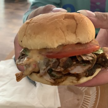 Pimenta - Close up of Negril Jerk Chicken Sandwich - Caribbean Near Me - Fredericksburg, Virginia Pimenta - Close up of Negril Jerk Chicken Sandwich - Caribbean Near Me - Fredericksburg, Virginia