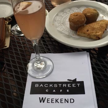 Backstreet Cafe - Think Pink Mimosas and their complimentary dish of scones and muffins. - New American Near Me - Houston, Texas