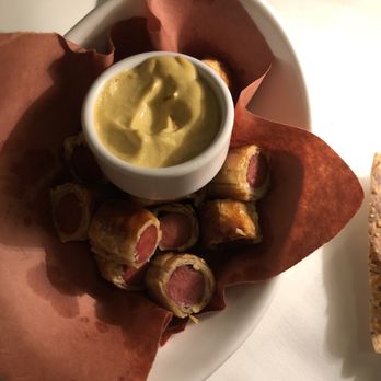 Aretsky's Patroon - Sausage bites wrapped in pretzel dough with a dijon mustard dipping sauce - American Near Me - New York, New York