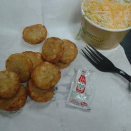 a tray of food and a cup of soda a tray of food and a cup of soda