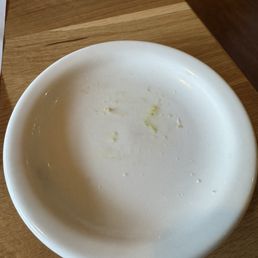 Dirty appetizer plate brought to table although they had just opened. Dirty appetizer plate brought to table although they had just opened.
