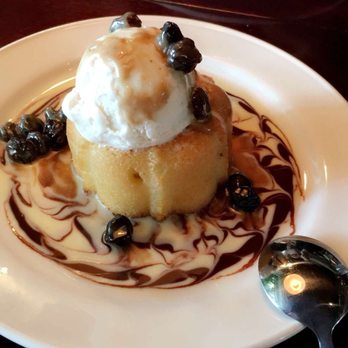 Bahama Breeze - Rum Cake An Island favorite made with Bacardi Oakheart Rum, topped with a handmade raisin butterscotch sauce and vanilla ice cream. - Bars Near Me - Miami, Florida Bahama Breeze - Rum Cake An Island favorite made with Bacardi Oakheart Rum, topped with a handmade raisin butterscotch sauce and vanilla ice cream. - Bars Near Me - Miami, Florida