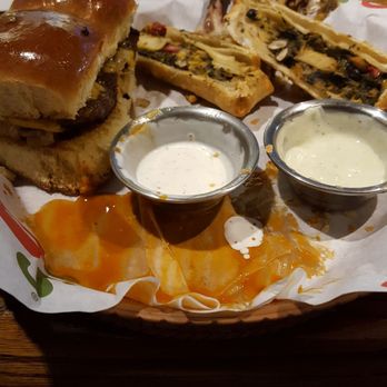 Chili's - Tearing up my fav meal at Chili's.  Triple Dipper!! Wings, sliders,  and the very best....SOUTH WESTERN EGG ROLLS!!!! - Bars Near Me - Wayne, Michigan