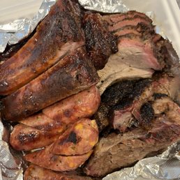 St. Louis Style Pork Ribs, Brisket, Tri Tip, Jalapeno and Cheese Sausage - 4 meat Combo St. Louis Style Pork Ribs, Brisket, Tri Tip, Jalapeno and Cheese Sausage - 4 meat Combo