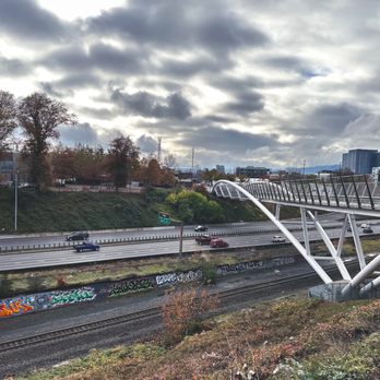 Blumenauer Bicycle and Pedestrian Bridge - From Lloyd Blvd view south with I-84 and the railroad tracks - Landmarks & Historical Buildings Near Me - Portland, Oregon Blumenauer Bicycle and Pedestrian Bridge - From Lloyd Blvd view south with I-84 and the railroad tracks - Landmarks & Historical Buildings Near Me - Portland, Oregon