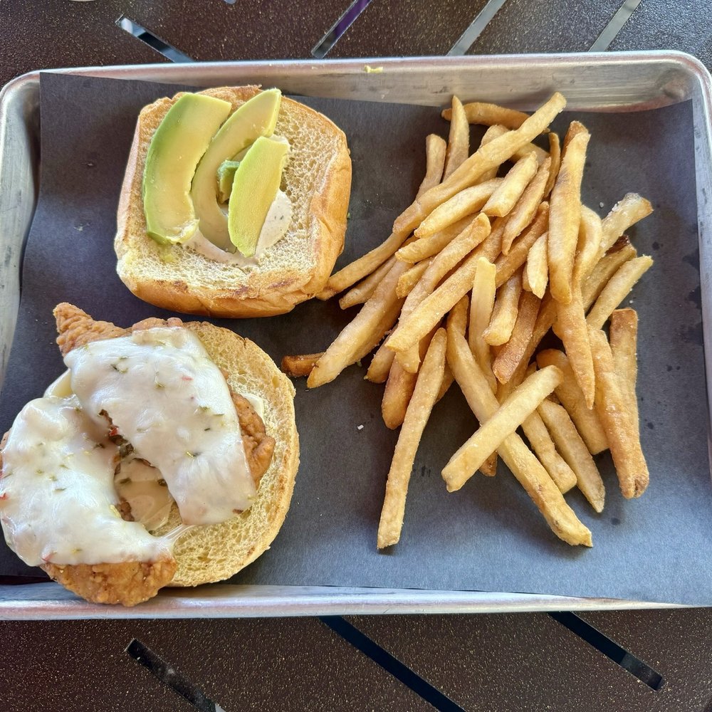 Escudo's Bar & Grill - "Spicy Chicken Sandwich" (crispy chicken tenders topped with pepper jack cheese, avocado, bacon & jalapeño ranch on a challah bun) - Cocktail Bars Near Me - Orlando, Florida Escudo's Bar & Grill - "Spicy Chicken Sandwich" (crispy chicken tenders topped with pepper jack cheese, avocado, bacon & jalapeño ranch on a challah bun) - Cocktail Bars Near Me - Orlando, Florida